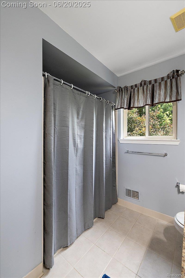 18852 Newbridge Dr, Macomb, MI 48044 - bathroom featuring tile patterned flooring and curtained shower