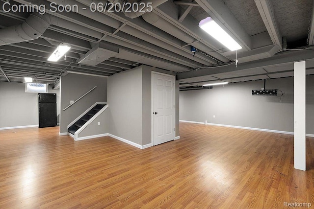18852 Newbridge Dr, Macomb, MI 48044 - finished below grade area featuring stairs and wood finished floors