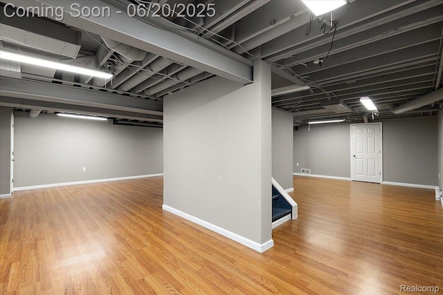 18852 Newbridge Dr, Macomb, MI 48044 - finished below grade area with wood finished floors and stairway