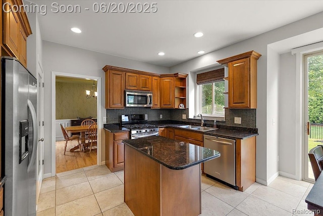 18852 Newbridge Dr, Macomb, MI 48044 - kitchen featuring stainless steel appliances, a center island, backsplash, brown cabinetry, and recessed lighting