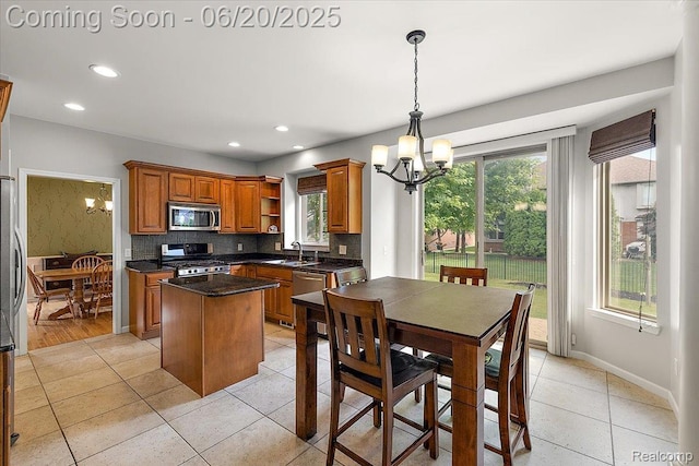 18852 Newbridge Dr, Macomb, MI 48044 - kitchen featuring appliances with stainless steel finishes, a chandelier, open shelves, plenty of natural light, and recessed lighting