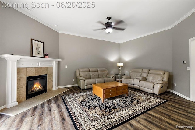 18852 Newbridge Dr, Macomb, MI 48044 - living area featuring wood finished floors, a ceiling fan, crown molding, and a tiled fireplace