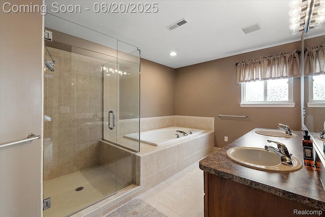 18852 Newbridge Dr, Macomb, MI 48044 - bathroom with a garden tub, a stall shower, double vanity, tile patterned flooring, and recessed lighting