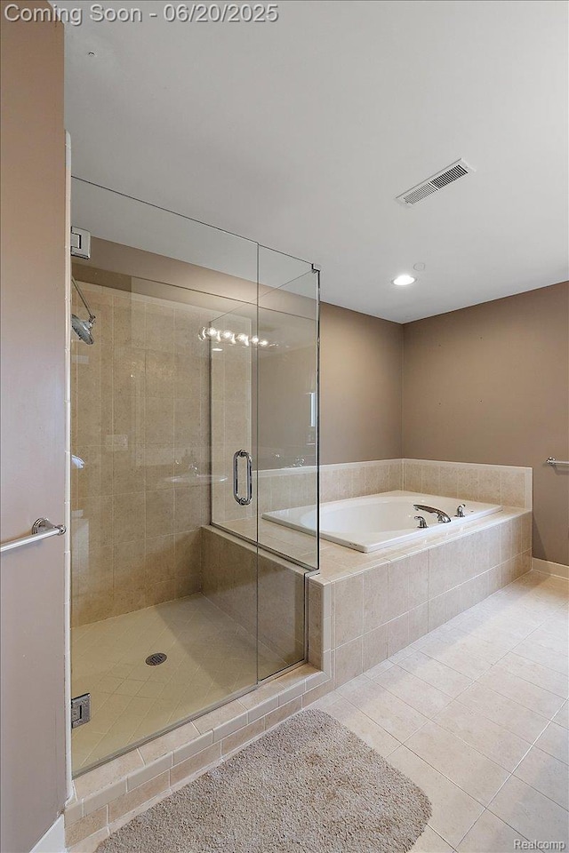 18852 Newbridge Dr, Macomb, MI 48044 - bathroom with a bath, tile patterned floors, a shower stall, and recessed lighting