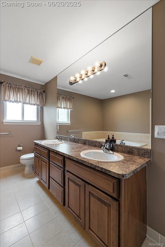 18852 Newbridge Dr, Macomb, MI 48044 - full bathroom with double vanity and tile patterned floors
