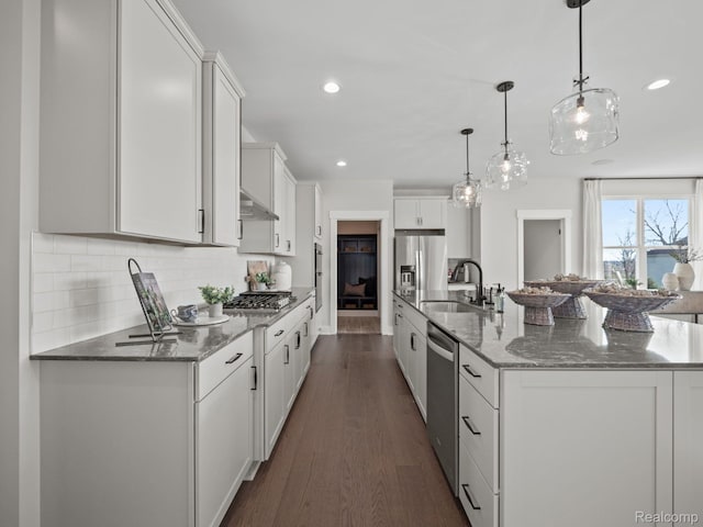 24654 Floret, Macomb, MI 48042 - kitchen with appliances with stainless steel finishes, white cabinets, a large island with sink, dark wood-type flooring, and tasteful backsplash