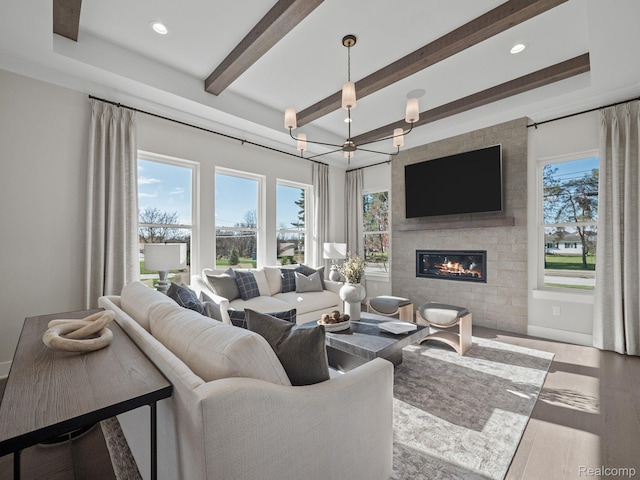 24654 Floret, Macomb, MI 48042 - living area featuring a chandelier, a fireplace, beam ceiling, recessed lighting, and wood finished floors