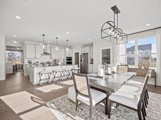 24654 Floret, Macomb, MI 48042 - dining area with plenty of natural light, recessed lighting, light wood-style flooring, and a chandelier