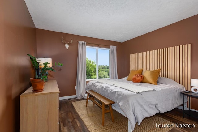 14734 Crescent Meadows Dr, Cedar Springs, MI 49319 - bedroom with dark wood-type flooring and a textured ceiling