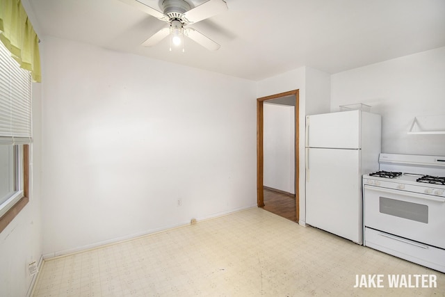 1428 Matilda St NE, Grand Rapids, MI 49503 - kitchen featuring white appliances, light floors, and a ceiling fan