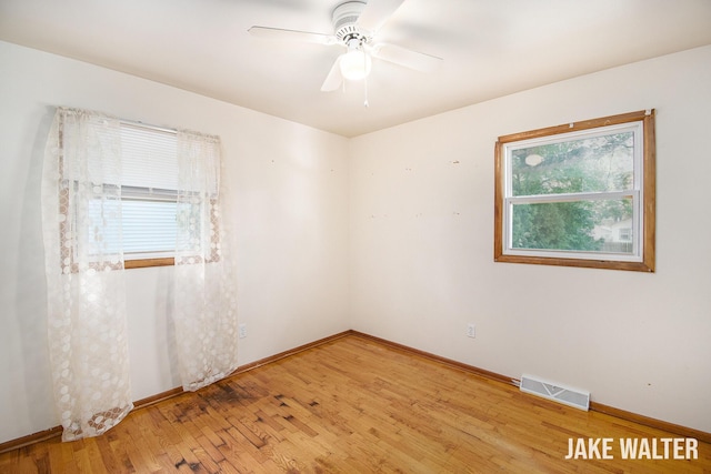 1428 Matilda St NE, Grand Rapids, MI 49503 - spare room featuring light wood-style flooring and a ceiling fan