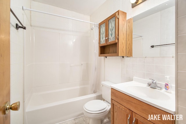 1428 Matilda St NE, Grand Rapids, MI 49503 - bathroom featuring shower / tub combo with curtain, tasteful backsplash, vanity, tile walls, and tile patterned floors