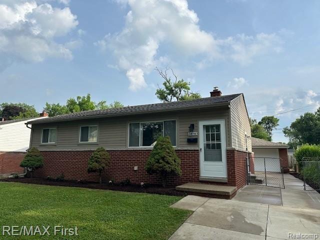 34940 John St, Wayne, MI 48184 - bungalow featuring brick siding, a chimney, and a detached garage