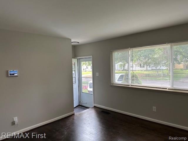 34940 John St, Wayne, MI 48184 - foyer featuring baseboards and dark wood-type flooring