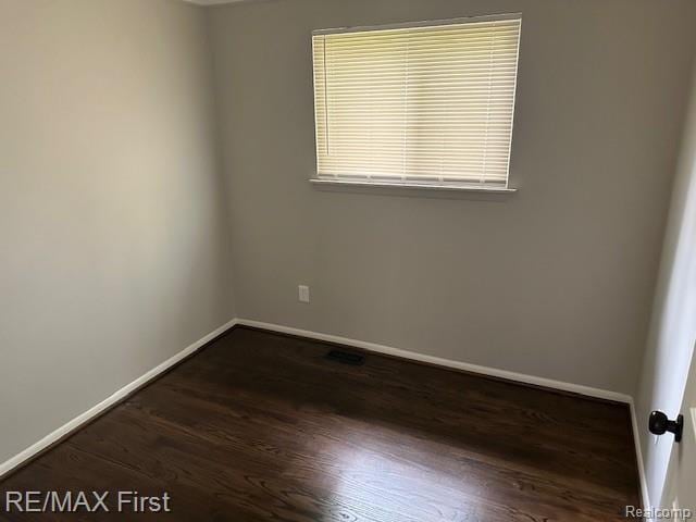 34940 John St, Wayne, MI 48184 - unfurnished room with baseboards and wood finished floors