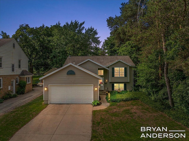 1910 Hall St SE, Grand Rapids, MI 49506 - view of front of home with concrete driveway, a front lawn, and a garage