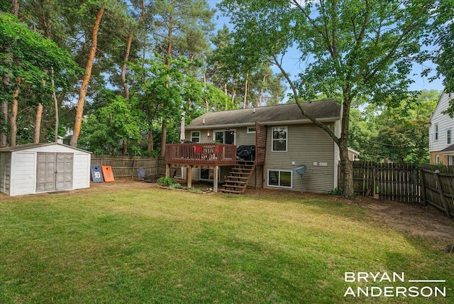 1910 Hall St SE, Grand Rapids, MI 49506 - back of house featuring stairway, a wooden deck, a shed, and a fenced backyard