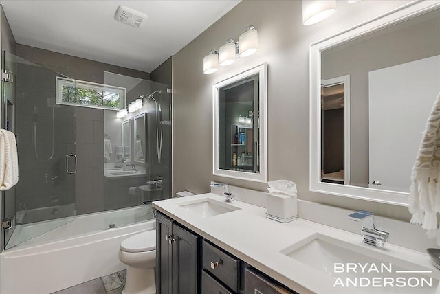1910 Hall St SE, Grand Rapids, MI 49506 - full bath with double vanity, enclosed tub / shower combo, and marble finish floors