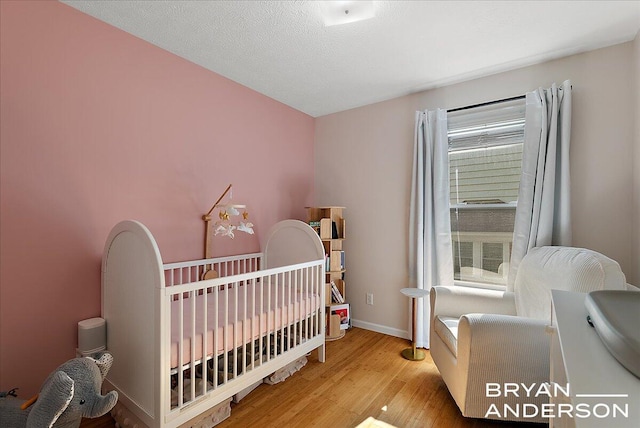 1910 Hall St SE, Grand Rapids, MI 49506 - bedroom with wood finished floors and a nursery area