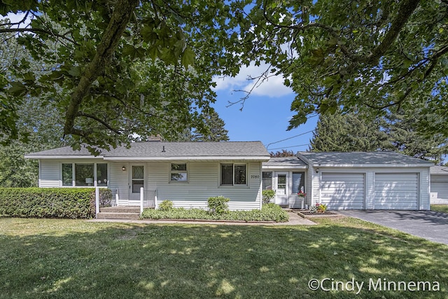 7080 Pine Island Dr NE, Comstock Park, MI 49321 - single story home with a garage, driveway, a front yard, an outbuilding, and a chimney