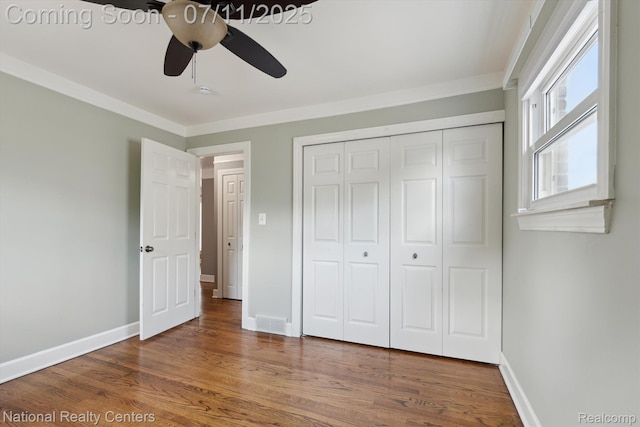 32203 Anita Dr, Westland, MI 48185 - unfurnished bedroom with wood finished floors, a closet, crown molding, and ceiling fan