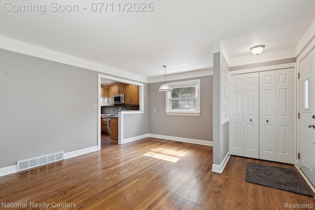 32203 Anita Dr, Westland, MI 48185 - foyer entrance with baseboards and wood finished floors