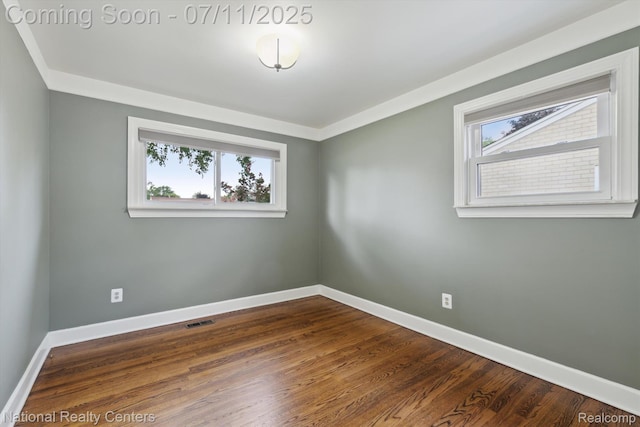32203 Anita Dr, Westland, MI 48185 - spare room featuring healthy amount of natural light and dark wood-style flooring