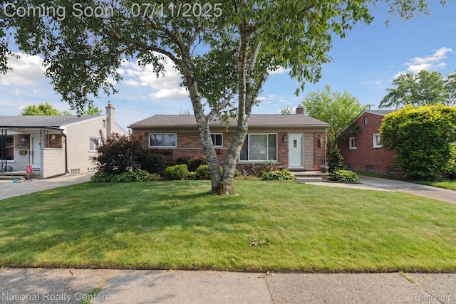 32203 Anita Dr, Westland, MI 48185 - ranch-style house featuring brick siding, a front yard, and a chimney