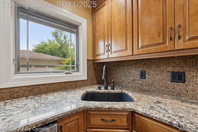 32203 Anita Dr, Westland, MI 48185 - kitchen with tasteful backsplash, light stone counters, and brown cabinets