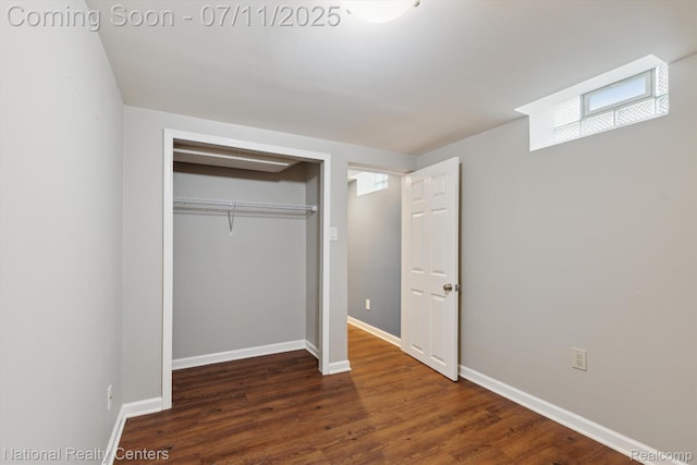 32203 Anita Dr, Westland, MI 48185 - unfurnished bedroom with a closet and dark wood-style floors
