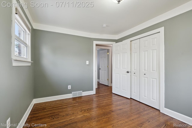32203 Anita Dr, Westland, MI 48185 - unfurnished bedroom with a closet and wood finished floors