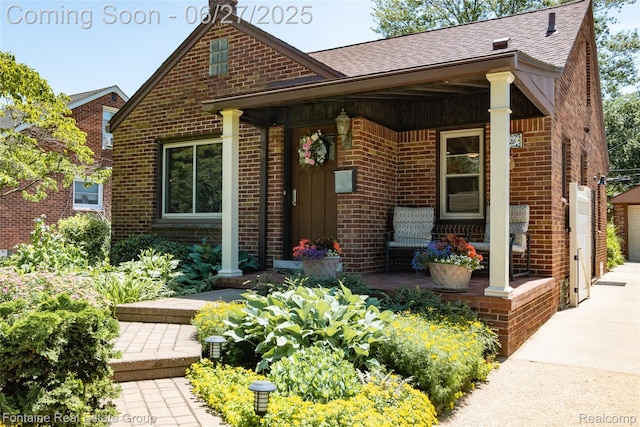 21626 Oconnor St, Saint Clair Shores, MI 48080 - view of front of property featuring brick siding, a shingled roof, a porch, a garage, and driveway