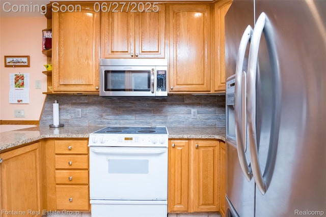 21626 Oconnor St, Saint Clair Shores, MI 48080 - kitchen with appliances with stainless steel finishes, decorative backsplash, and light stone counters