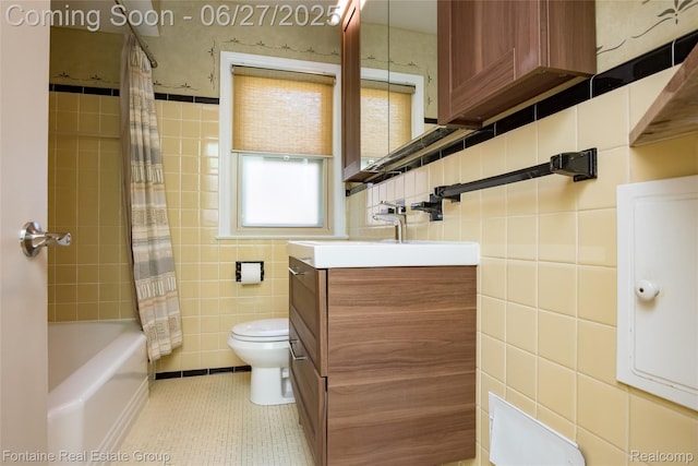 21626 Oconnor St, Saint Clair Shores, MI 48080 - bathroom featuring tile walls, vanity, tile patterned floors, and shower / bathtub combination with curtain