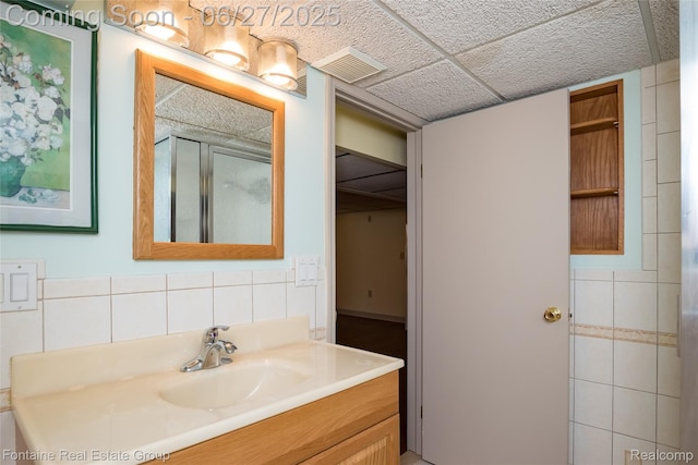 21626 Oconnor St, Saint Clair Shores, MI 48080 - bathroom featuring vanity, a shower stall, and tile walls