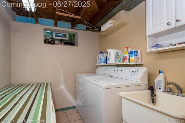 21626 Oconnor St, Saint Clair Shores, MI 48080 - laundry room featuring washer and dryer, light tile patterned floors, and cabinet space
