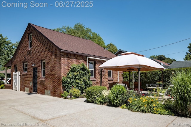 21626 Oconnor St, Saint Clair Shores, MI 48080 - view of front facade with brick siding, roof with shingles, and driveway