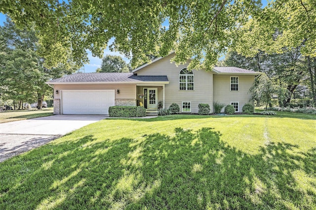 3700 Mapledge Ct NE, Cedar Springs, MI 49319 - split level home with an attached garage, driveway, and a front lawn