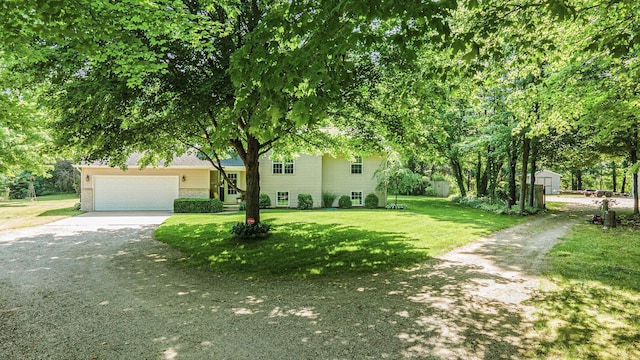 3700 Mapledge Ct NE, Cedar Springs, MI 49319 - view of front facade with gravel driveway, a shed, a front yard, and a garage