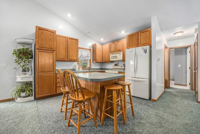 3700 Mapledge Ct NE, Cedar Springs, MI 49319 - kitchen with white appliances, a center island, a kitchen breakfast bar, carpet, and recessed lighting