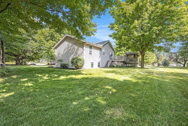 3700 Mapledge Ct NE, Cedar Springs, MI 49319 - view of green lawn featuring a deck