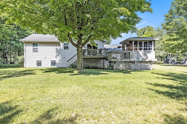 3700 Mapledge Ct NE, Cedar Springs, MI 49319 - view of grassy yard featuring a sunroom and a deck