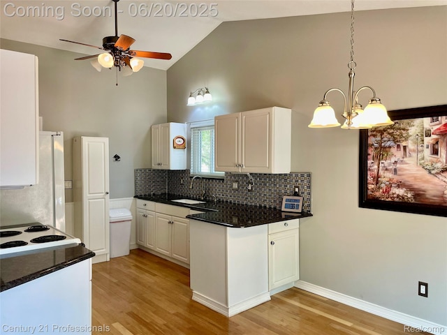 6850 Deerhurst Dr, Westland, MI 48185 - kitchen featuring high vaulted ceiling, light wood-style flooring, a ceiling fan, white cabinets, and decorative backsplash