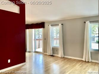 6850 Deerhurst Dr, Westland, MI 48185 - doorway to outside featuring wood finished floors