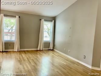 6850 Deerhurst Dr, Westland, MI 48185 - unfurnished room with wood finished floors and lofted ceiling