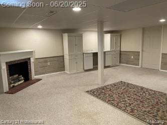 6850 Deerhurst Dr, Westland, MI 48185 - finished basement featuring recessed lighting, a fireplace with raised hearth, and carpet flooring
