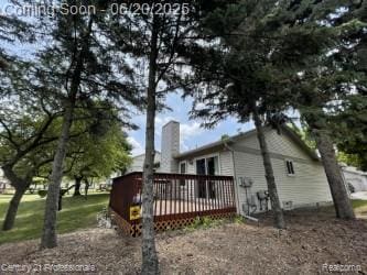 6850 Deerhurst Dr, Westland, MI 48185 - view of property exterior featuring a wooden deck and a chimney