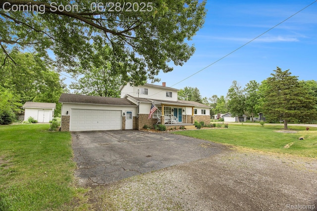 2371 Bradford Dr, Grand Blanc, MI 48507 - traditional-style house featuring driveway, a garage, brick siding, and a front lawn