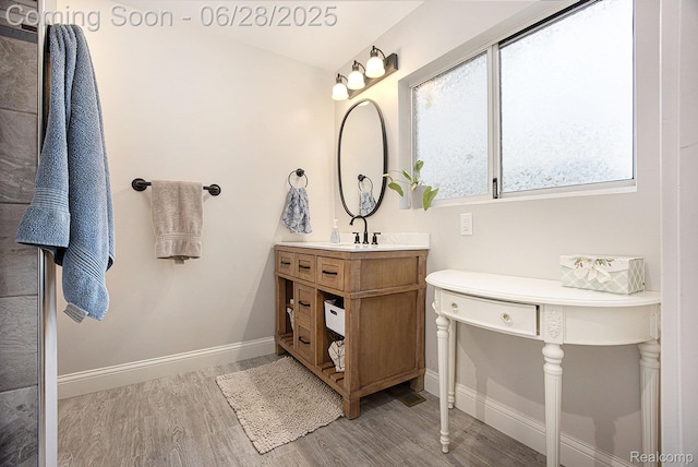 2371 Bradford Dr, Grand Blanc, MI 48507 - bathroom featuring wood finished floors and vanity