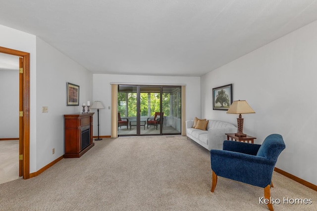 766 Clarewood Ct, Holland, MI 49423 - living area with light colored carpet and a fireplace